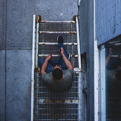 Linx Eden Convection Vaporizer, A Portable Vape outside being held by a man on a staircase